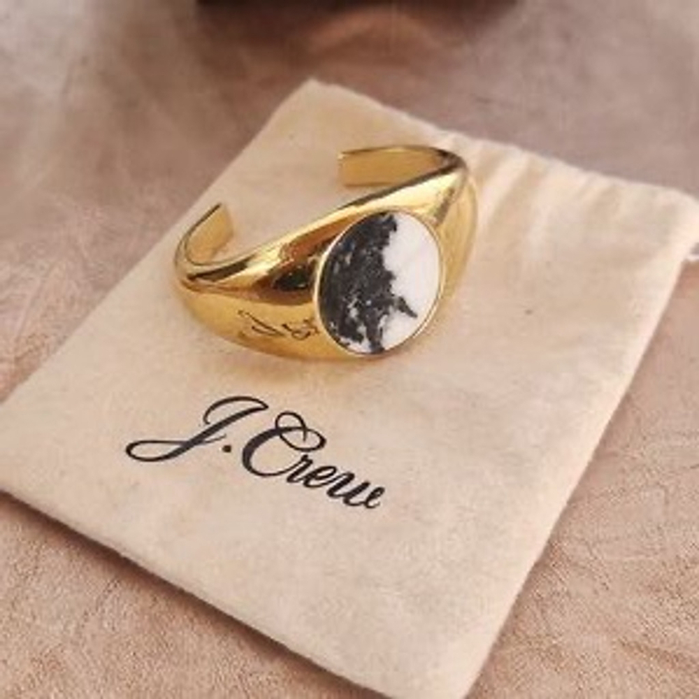 J. Crew gold signet bracelet with black and white stone